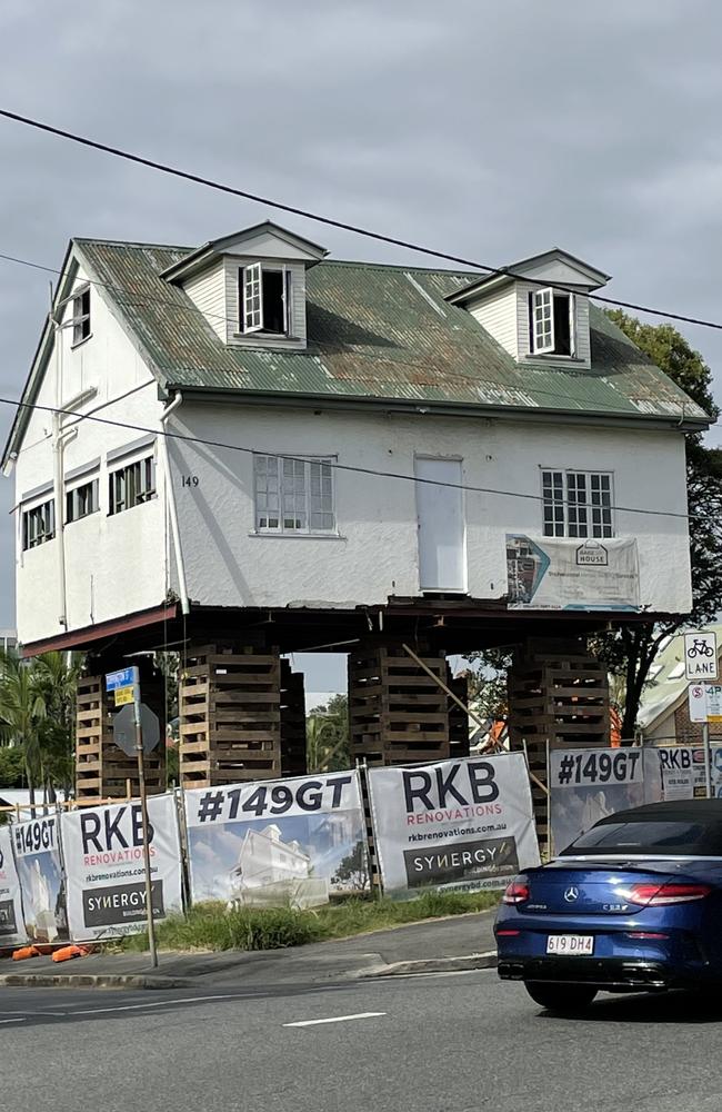 The 1875 house raised up to allow redevelopment.