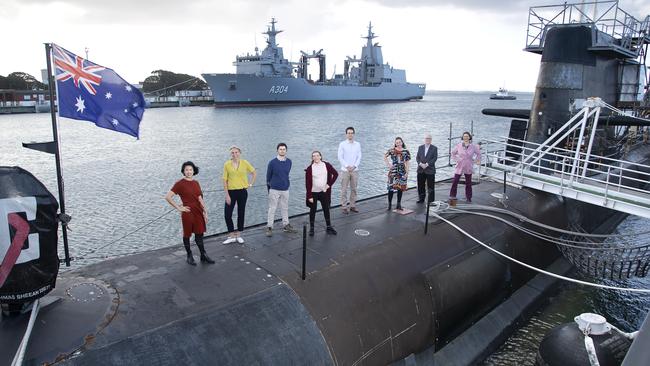 Staff from the Future of Work Institute at Curtin University stand on submarine HMAS Sheean at Fleet Base West in WA.