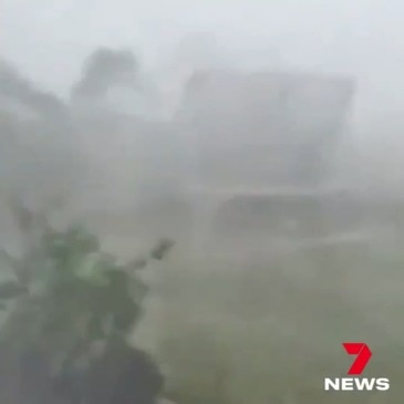 A wild storm lashes Bribie Island sending a trampoline flying