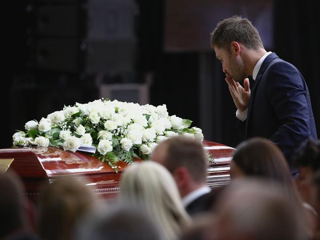 Australian cricket captain Michael Clarke pays his respect to Phillip Hughe. Picture: AAP Image/Getty