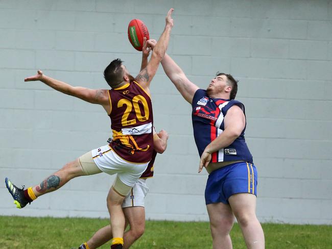 Lyndale’s Brendon Groenendyk goes up against Dandenong’s Ashton Brunning.