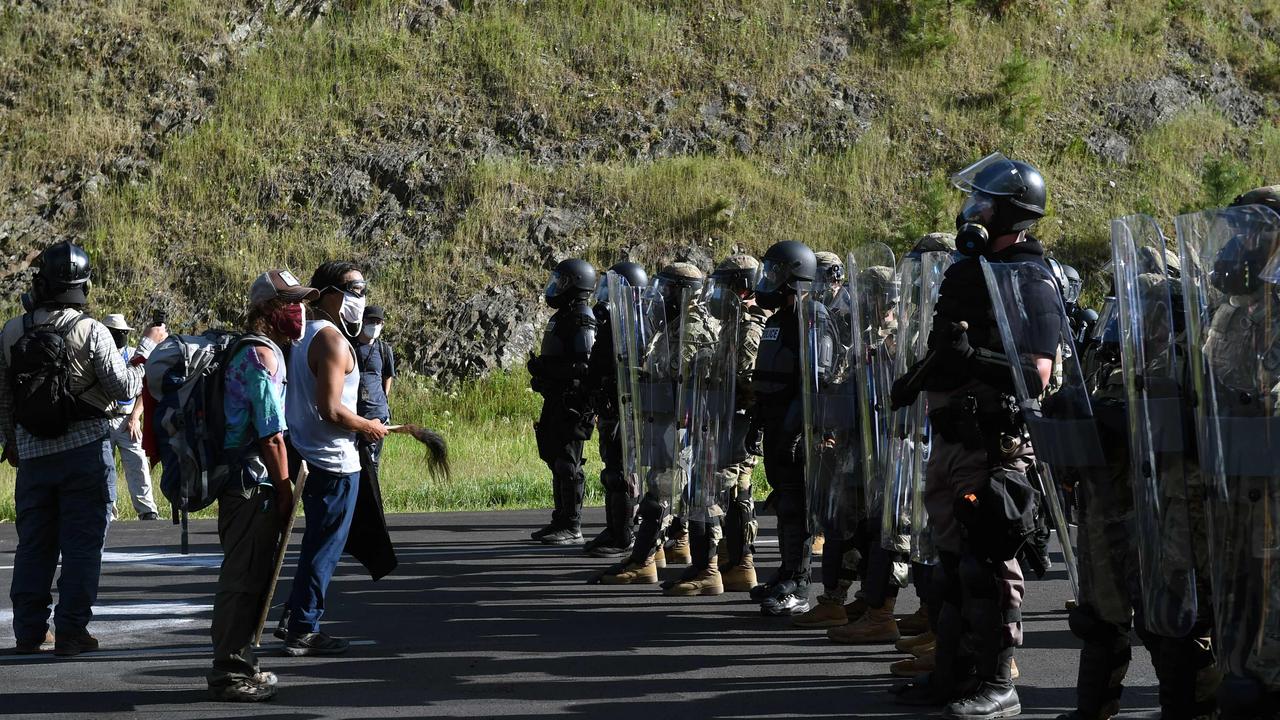 Activists stand off with the National Guard at Mount Rushmore. Picture: Andrew Caballero-Reynolds / AFP