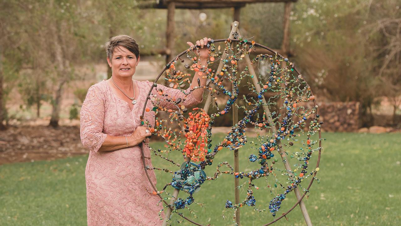 Wired up: Kylee Tindale-Smith with wire artwork, a skill she teaches at workshops in Morven, Queensland. Picture: Olivia Johnson