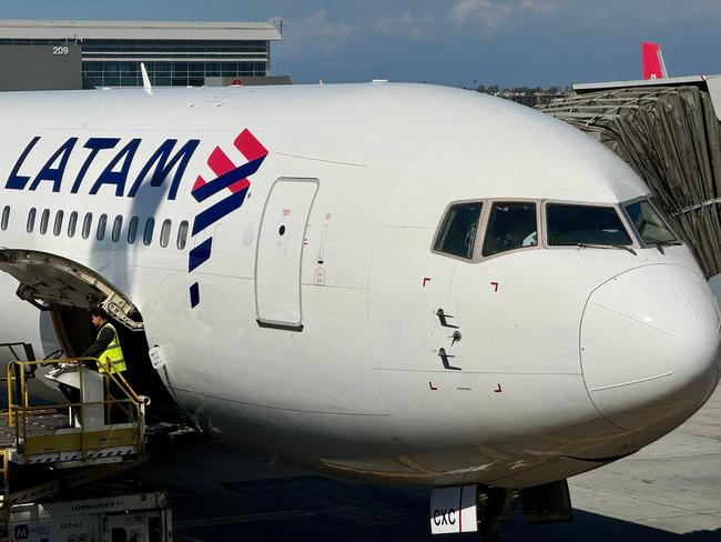 A LATAM plane sits at gate at Los Angeles Airport (LAX), in Los Angeles, California, on March 11, 2024. (Photo by Daniel SLIM / AFP)