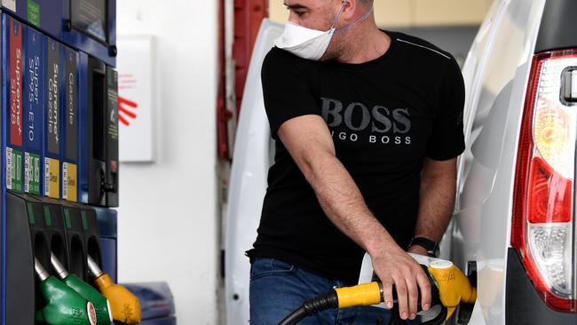 A man stops to refuel his car at a petrol filling station. Photo: FRANCK FIFE / AFP