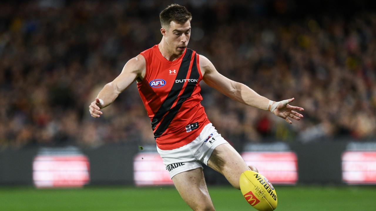 Zach Merrett of the Bombers kicks. (Photo by Mark Brake/Getty Images)