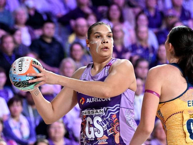 BRISBANE, AUSTRALIA - JULY 06: Donnell Wallam of the Firebirds looks to pass during the round 13 Super Netball match between Queensland Firebirds and Sunshine Coast Lightning at Nissan Arena, on July 06, 2024, in Brisbane, Australia. (Photo by Bradley Kanaris/Getty Images)