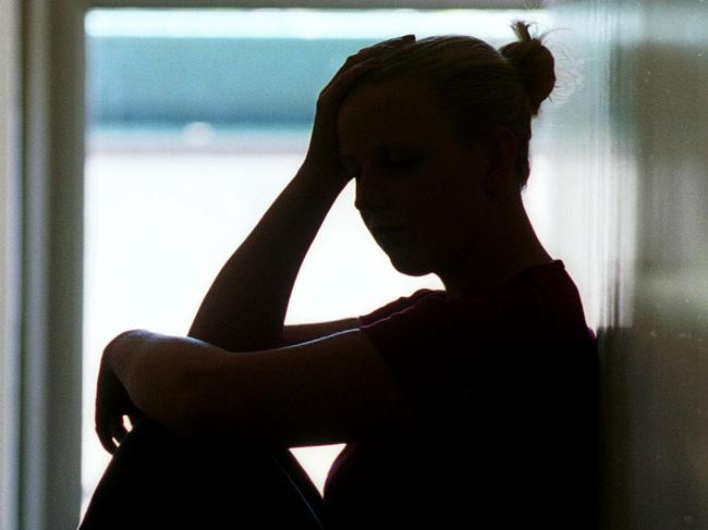 21 Dec 2001 Silhouette of young woman seated in doorway, date rape victim in Adelaide. Sexual Assault crime sa sex generic