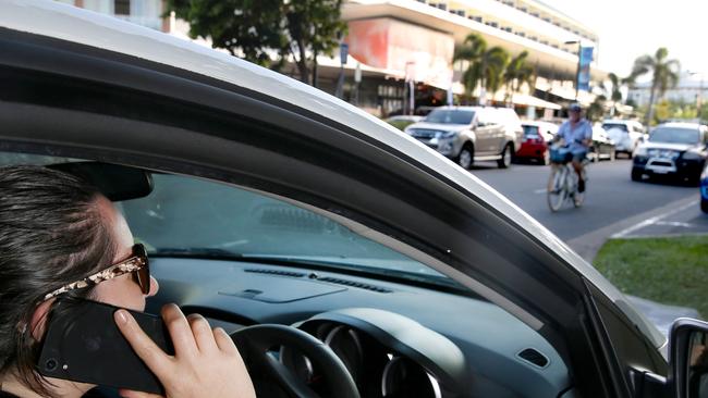 Motorists caught driving in Queensland while on their mobile phones face $1000 fines from tomorrow. Picture: Anna Rogers