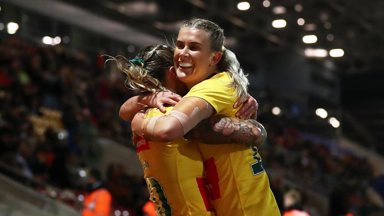 YORK, ENGLAND – NOVEMBER 02: Julia Robinson of Australia celebrates with teammate Shenae Ciesiolka after scoring their team's seventh try during the Women's Rugby League World Cup 2021 Pool B match between Australia Women and Cook Islands Women at LNER Community Stadium on November 02, 2022 in York, England. (Photo by George Wood/Getty Images)