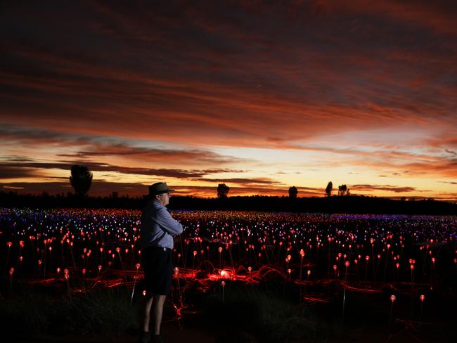 Artist Bruce Munro with his Field of Light exhibition near Uluru. Picture: Mark Pickthall