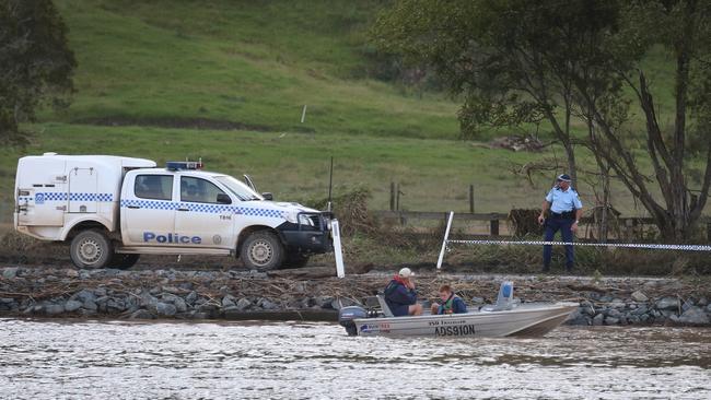 Three dead in Tweed River tragedy. Matt Grinham and son Thomas, 15, used a depth sounder to locate the car in the river at Tumbulgum. Picture: Glenn Hampson