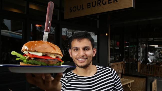 Amit Tewari with a vegetarian burger at Soul Burger, Randwick. Picture: Craig Wilson