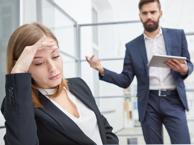 CAREERS FOR MAY 23: Angry displeased employer unsatisfied with employees work and berating young female manager leaning on hand and looking at report indifferently