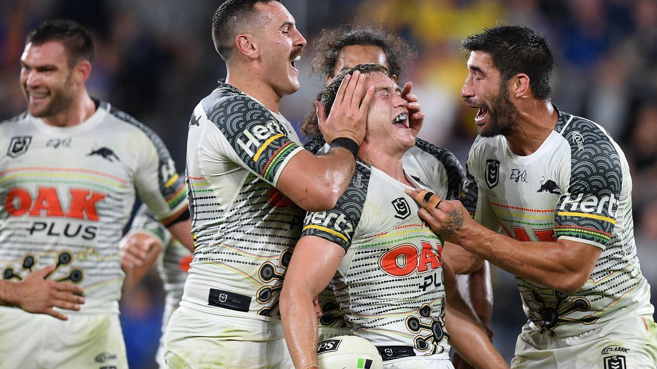 Mitchell Kenny (centre) celebrates with Reagan Campbell-Gillard (left) and James Tamou