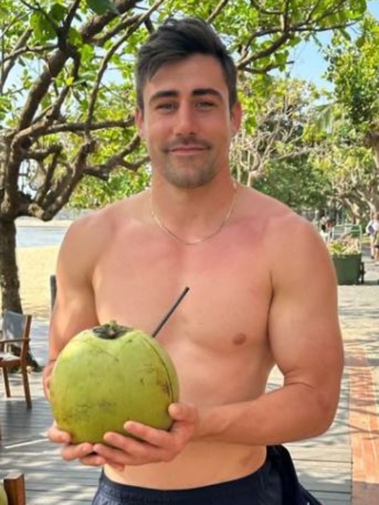 Nick sipping on a coconut.