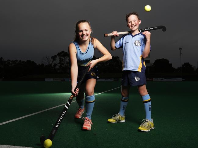 Junior hockey players and siblings Lucy, 14 and Angus McMullen, 11, of New Town, are excited to get back on the hockey field. Picture: ZAK SIMMONDS