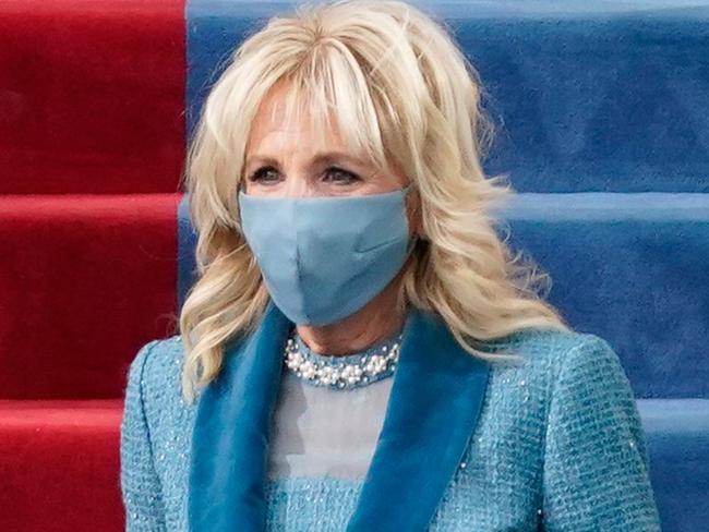 US President-elect Joe Biden flanked by wife Dr. Jill Biden arriving for his inauguration as the 46th US President on January 20, 2021, at the US Capitol in Washington, DC. (Photo by Patrick Semansky / AFP)