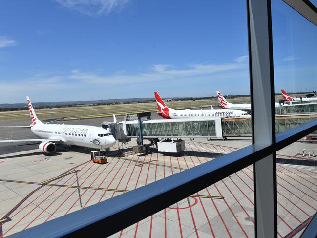 Planes parked at an empty Adelaide Airport. Picture: Keryn Stevens