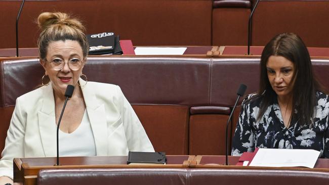 Senator Tammy Tyrrell and Senator Jacqui Lambie in the Senate during the Treasury Laws Amendment (Electric Car Discount) Bill 2022 at Parliament House in Canberra. Picture: NCA NewsWire / Martin Ollman