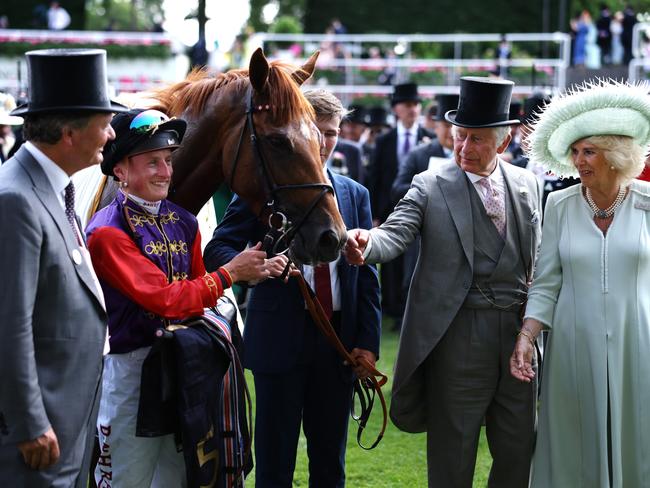 ASCOT, ENGLAND - JUNE 22: Desert Hero ridden by Tom Marquand with owners HM the King and HM The Queen after The King George V Stakes during day three of Royal Ascot 2023 at Ascot Racecourse on June 22, 2023 in Ascot, England. (Photo by Alex Pantling/Getty Images)