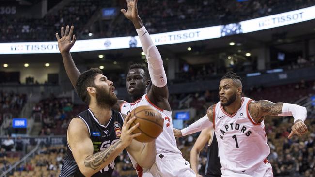 Deng Adel tries to stop Melbourne United's Tohi Smith-Milner.