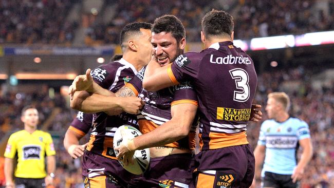 Matt Gillett celebrates scoring a try for the Broncos.