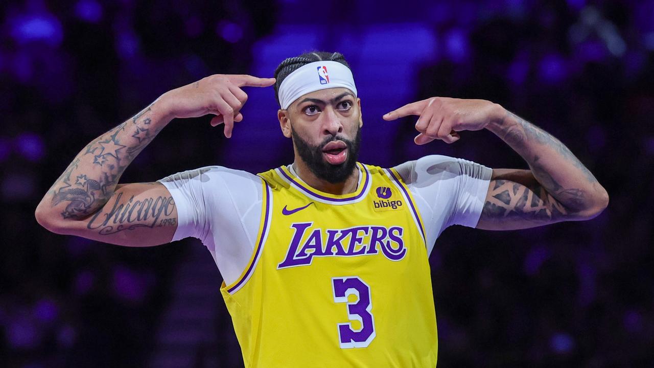 LAS VEGAS, NEVADA - DECEMBER 07: Anthony Davis #3 of the Los Angeles Lakers gestures toward LeBron James #23 after James hit a 3-pointer against the New Orleans Pelicans in the second half of the West semifinal game of the inaugural NBA In-Season Tournament at T-Mobile Arena on December 07, 2023 in Las Vegas, Nevada. The Lakers defeated the Pelicans 133-89. NOTE TO USER: User expressly acknowledges and agrees that, by downloading and or using this photograph, User is consenting to the terms and conditions of the Getty Images License Agreement. (Photo by Ethan Miller/Getty Images)