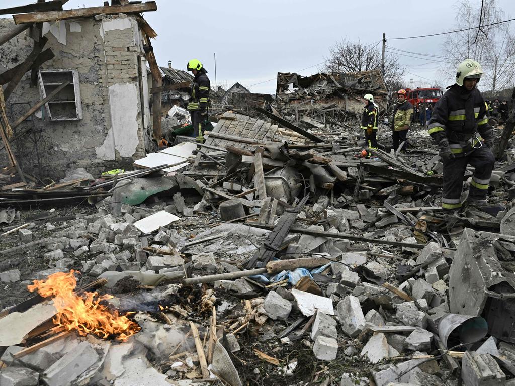 Rescuers clear debris of homes destroyed by a missile attack in the outskirts of Kyiv, on December 29, 2022, following another wave of Russian strikes on Ukraine. Picture: Genya Savilov / AFP.