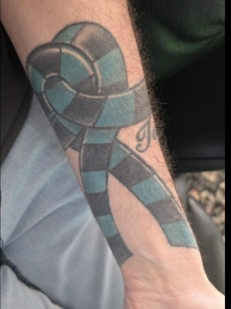 Port Adelaide tattoo on Ryan Creten, in memory of his grandfather and the football club. Picture: Supplied