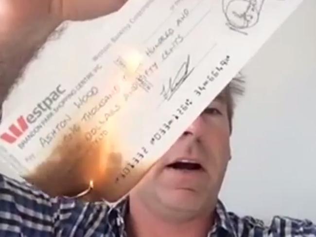 Jeep owner Ashton Wood burns a cheque he got from the official ACCC 