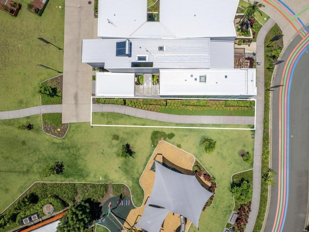 The block of land with footpath down the middle has listed for $400,000. Picture: Domain