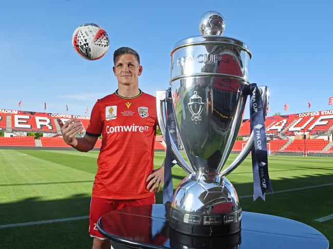 22/10/19 - Adelaide United FFA Cup final preview. Captain Michael Jakobsen Verbeek on the Hindmarsh Stadium pitch, with the FFA Cup trophy.Picture: Tom Huntley