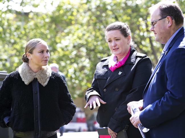 Katrina Munting (centre) outisde the Supreme Court of Tasmania on Friday, supported by survivor advocate Grace Tame and husband Danny Munting. Hobart. Picture: Chris Kidd.