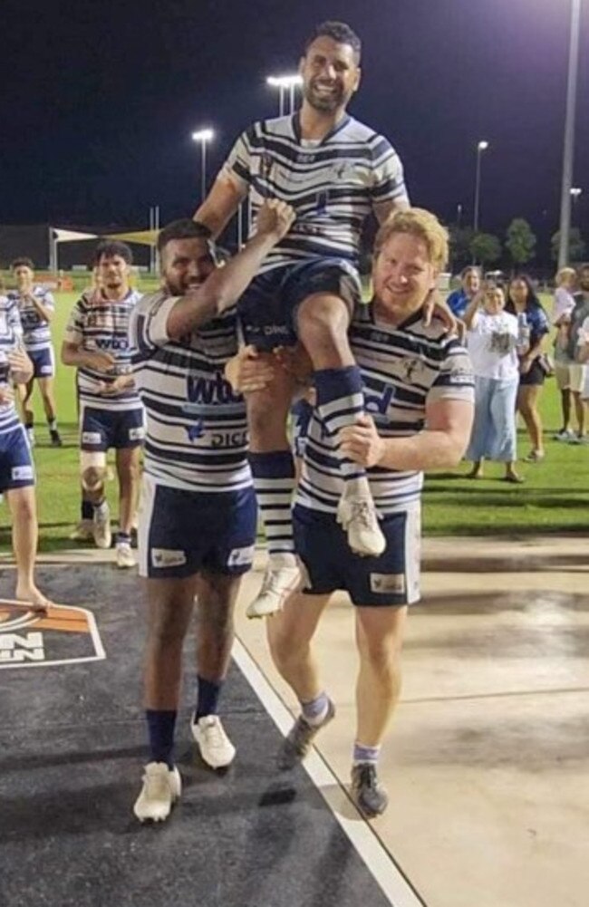 Aaron Pollard is carried off the field in his 100th NRLNT game by Darwin Brothers teammates Jonas Niki and Drew Tobin.