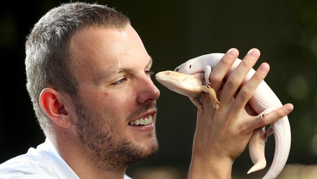 Kyle Chalmers with his blue tongue lizards. Picture: Calum Robertson