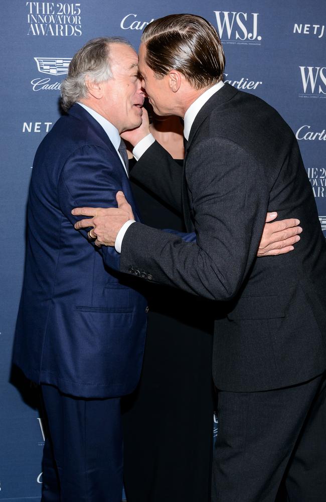 Brad Pitt kisses Robert Deniro at the WSJ. Magazine 2015 Innovator Awards at the Museum of Modern Art on November 4, 2015 in New York City. Picture: Splash