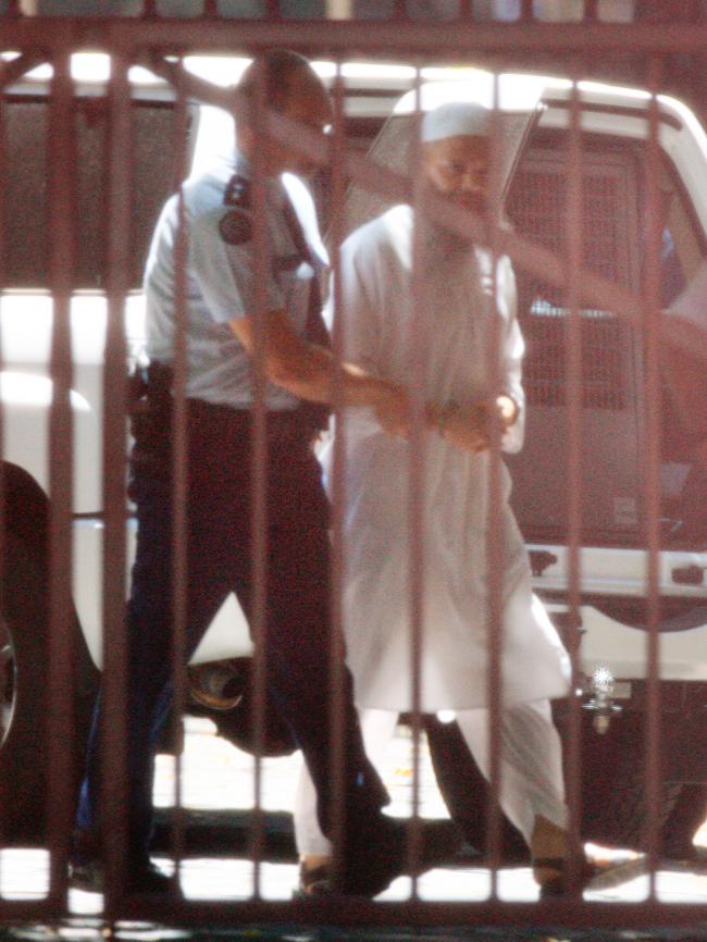 Terror suspect and Muslim cleric Abdul Nacer Benbrika is escorted from the Victorian Supreme Court in Melbourne, after his conviction and sentencing on terrorism charges.