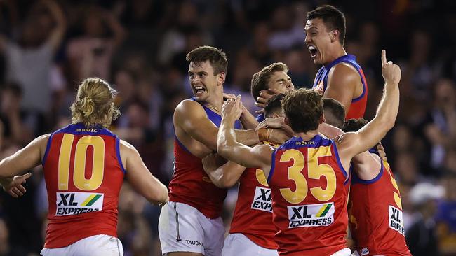 Zac Bailey is mobbed after his after-the-siren goal. Picture: Michael Klein