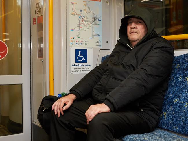 Homeless man Jeffries Collier on a train to Newcastle, on of his two preferred night-time services. Picture: David Swift