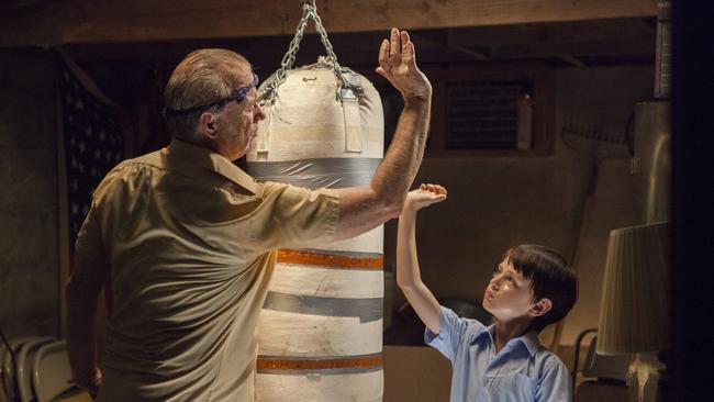 Thankfully dominates the movie ... Vincent (Bill Murray) teaches young Oliver (Jaeden Lieberher) to throw a punch. Picture: Village Roadshow films