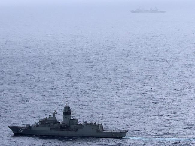 This handout photo taken on February 13, 2025 and released by The Australian Defence Force shows the Royal Australian Navy ship HMAS Arunta (lower L) sailing near the People's Liberation Army-Navy (PLA-N) Fuchi-class replenishment vessel and Weishanhu Jiangkai-class frigate Hengyang in the Tasman Sea. Australia's foreign minister voiced concern on February 21 over live fire drills conducted by three Chinese warships sailing off the country's east coast. (Photo by Handout / AUSTRALIAN DEFENCE FORCE / AFP) / RESTRICTED TO EDITORIAL USE - MANDATORY CREDIT "AFP PHOTO /  AUSTRALIAN DEFENCE FORCE" - NO MARKETING NO ADVERTISING CAMPAIGNS - DISTRIBUTED AS A SERVICE TO CLIENTS