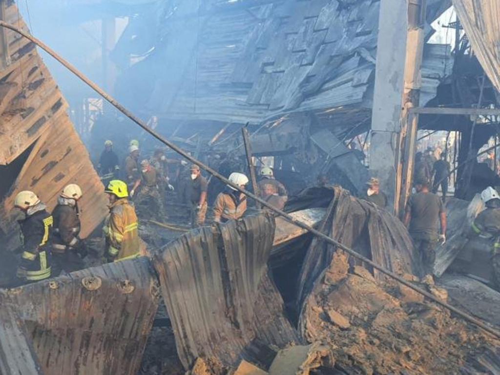 Rescuers working in a mall hit by a Russian missile strike in the eastern Ukrainian city of Kremenchuk. Picture: Ukraine's State Emergency Service / AFP