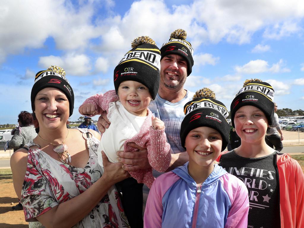 Tahlia May, holding grand-daughter Louella, with husband Adam and their children Sharlize and Lateesha show off their Bend beanies. Picture SARAH REED