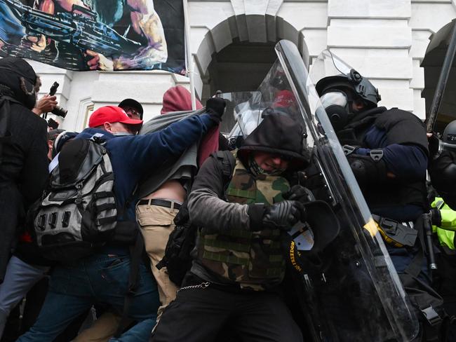 Police clashing with rioters on January 6. Picture: AFP