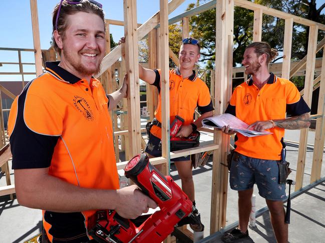 TAFE Queensland carpentry apprentices Ethan Sutherland and Karl Van Rijssen with apprentice manager Steve Purcell working on a 54-townhouse development at Richlands. Picture: Tara Croser.