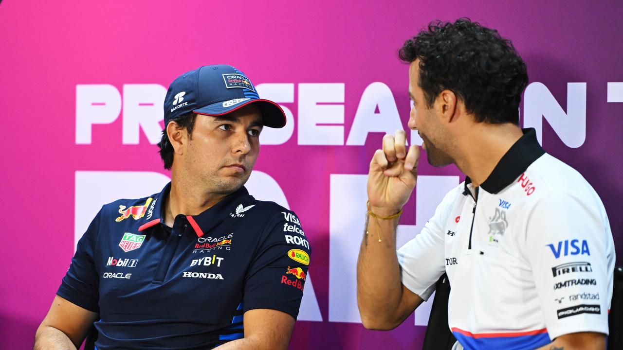 BAHRAIN, BAHRAIN - FEBRUARY 21: Sergio Perez of Mexico and Oracle Red Bull Racing and Daniel Ricciardo of Australia and Visa Cash App RB attend the Drivers Press Conference during day one of F1 Testing at Bahrain International Circuit on February 21, 2024 in Bahrain, Bahrain. (Photo by Rudy Carezzevoli/Getty Images)