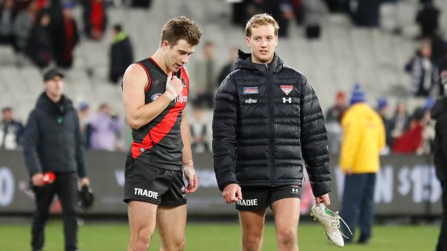 Darcy Parish (right) hurt his calf against Carlton. Picture: Michael Willson/AFL Photos via Getty Images