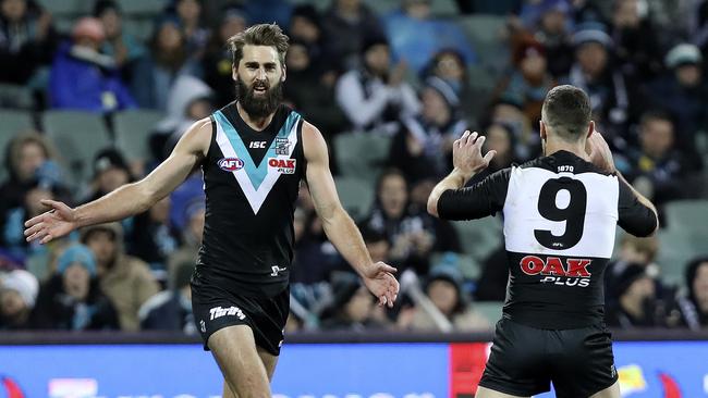 Justin Westhoff celebrates a goal with Robbie Gray. Picture SARAH REED