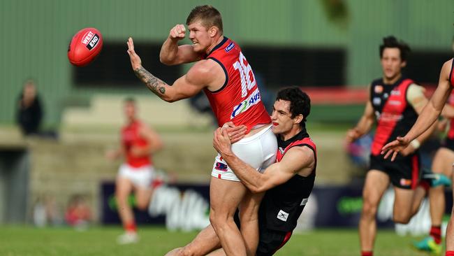 Norwood's Joshua Glenn tackled by West's Joshua Ryan. Picture: Tom Huntley